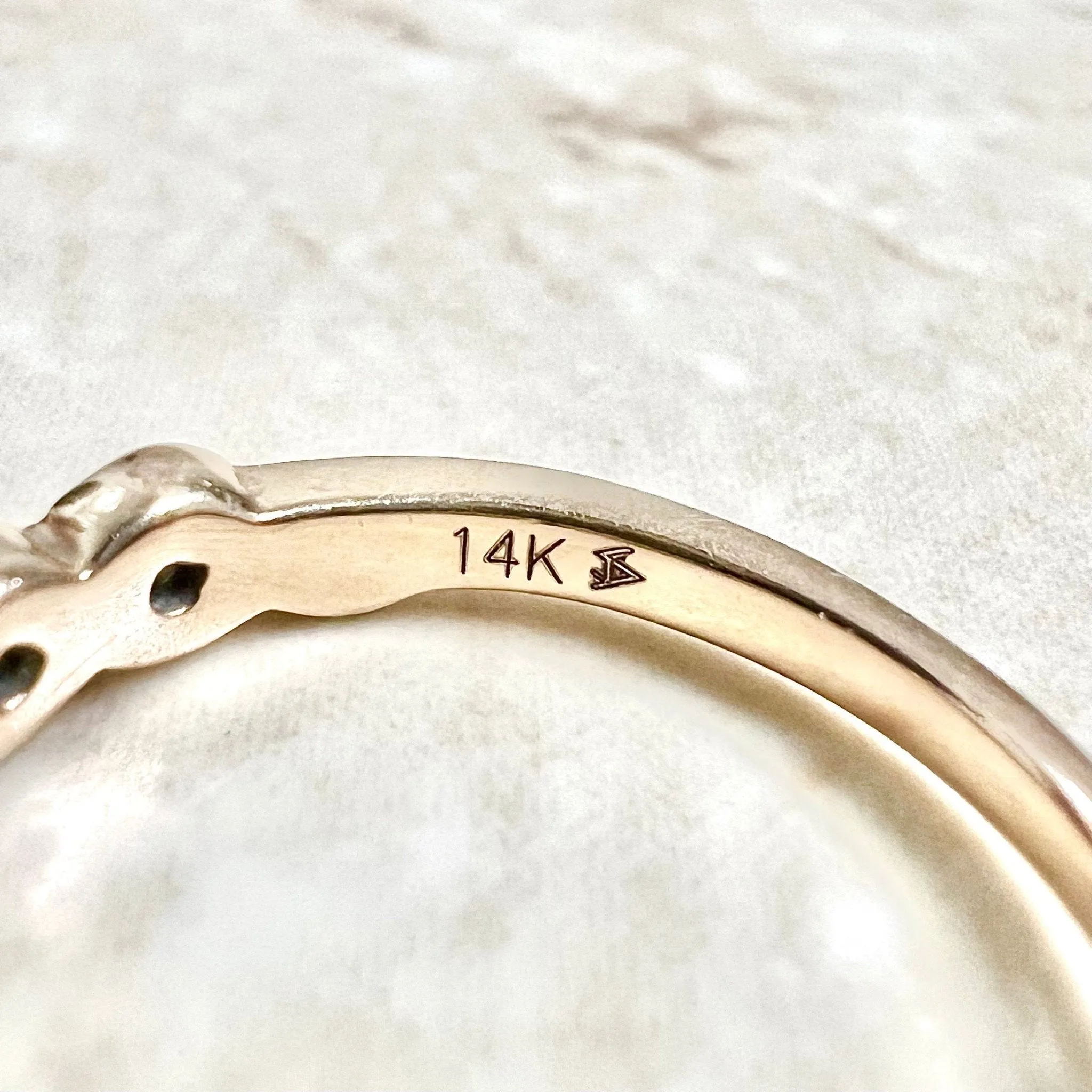 14 Karat Rose Gold Bezel-Set 0.25 Carat Diamond Seven-Stone Band Ring