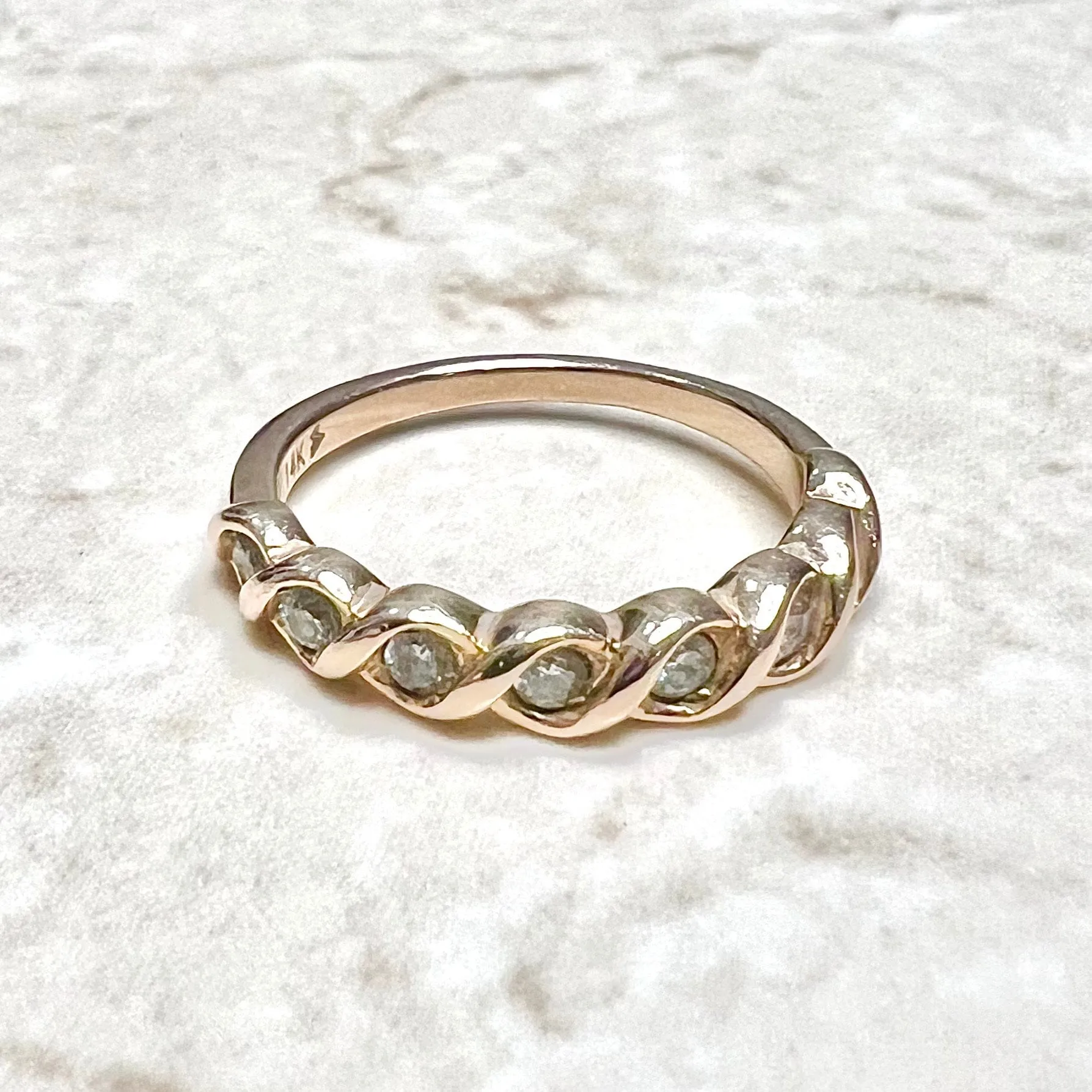 14 Karat Rose Gold Bezel-Set 0.25 Carat Diamond Seven-Stone Band Ring