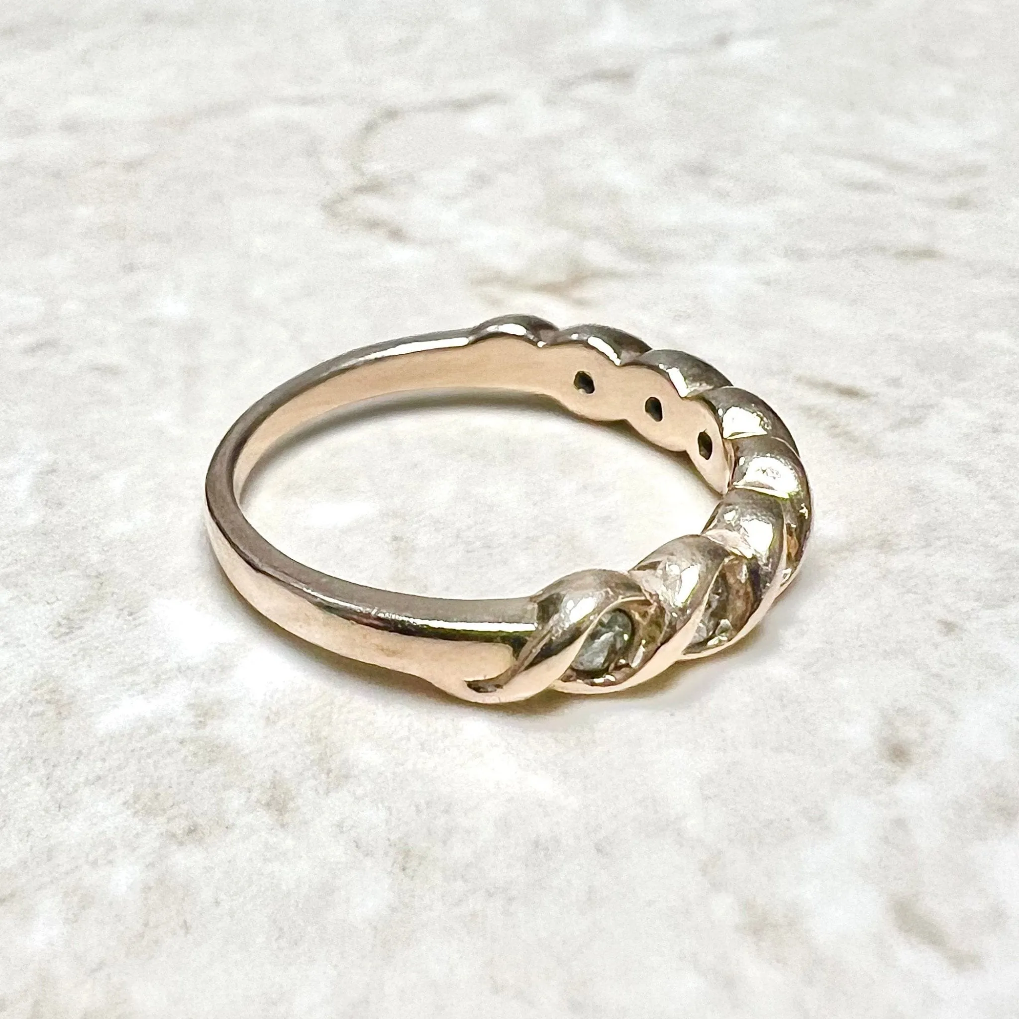 14 Karat Rose Gold Bezel-Set 0.25 Carat Diamond Seven-Stone Band Ring