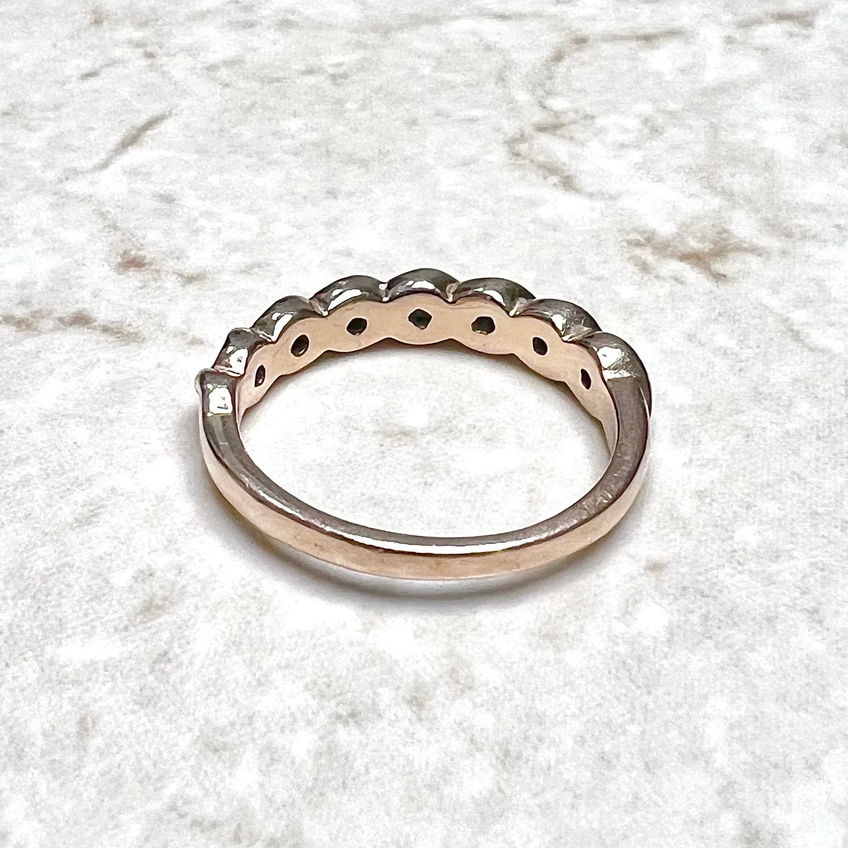 14 Karat Rose Gold Bezel-Set 0.25 Carat Diamond Seven-Stone Band Ring