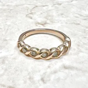 14 Karat Rose Gold Bezel-Set 0.25 Carat Diamond Seven-Stone Band Ring