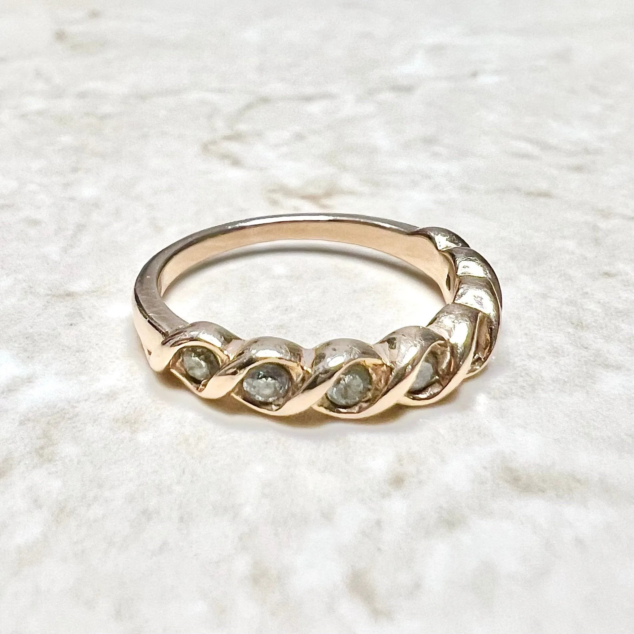 14 Karat Rose Gold Bezel-Set 0.25 Carat Diamond Seven-Stone Band Ring