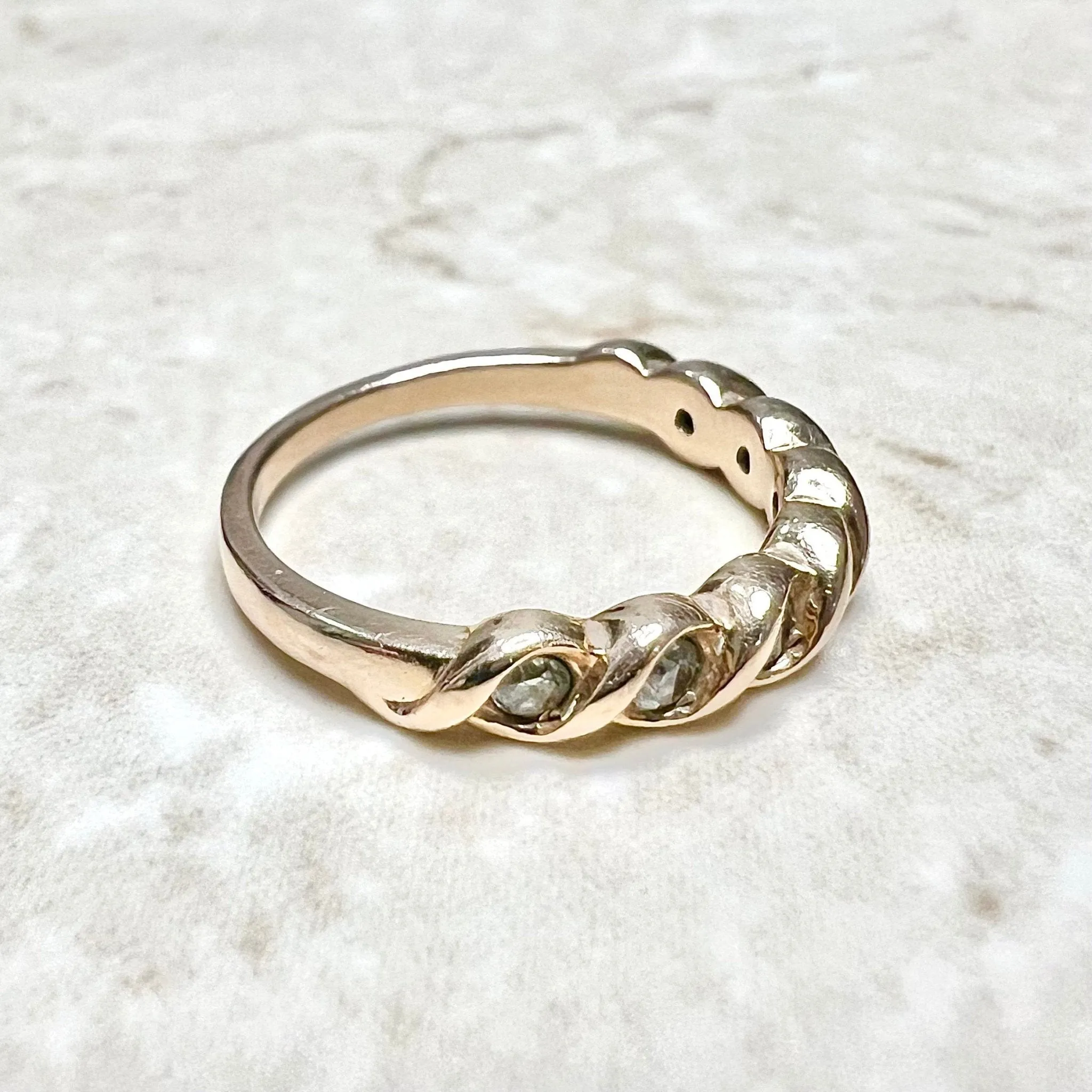 14 Karat Rose Gold Bezel-Set 0.25 Carat Diamond Seven-Stone Band Ring
