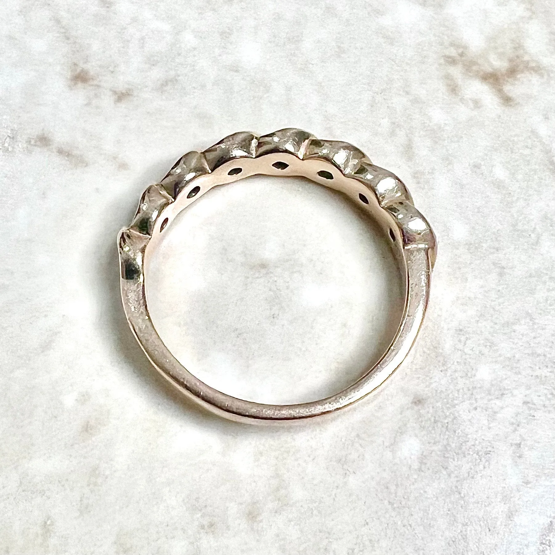 14 Karat Rose Gold Bezel-Set 0.25 Carat Diamond Seven-Stone Band Ring