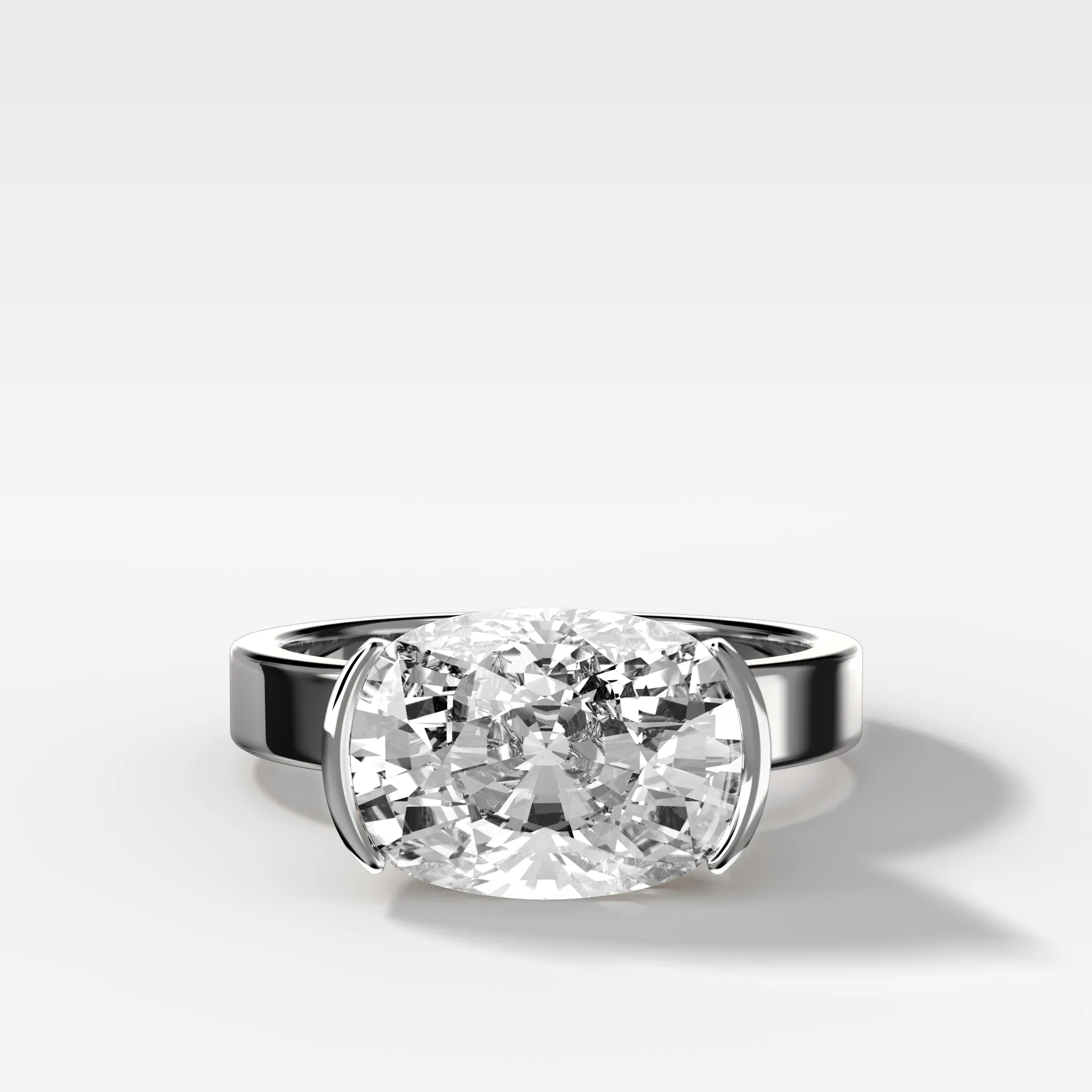 Finest Half Bezel Solitaire Engagement Ring With East West Elongated Cushion Cut Diamond