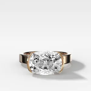 Finest Half Bezel Solitaire Engagement Ring With East West Elongated Cushion Cut Diamond