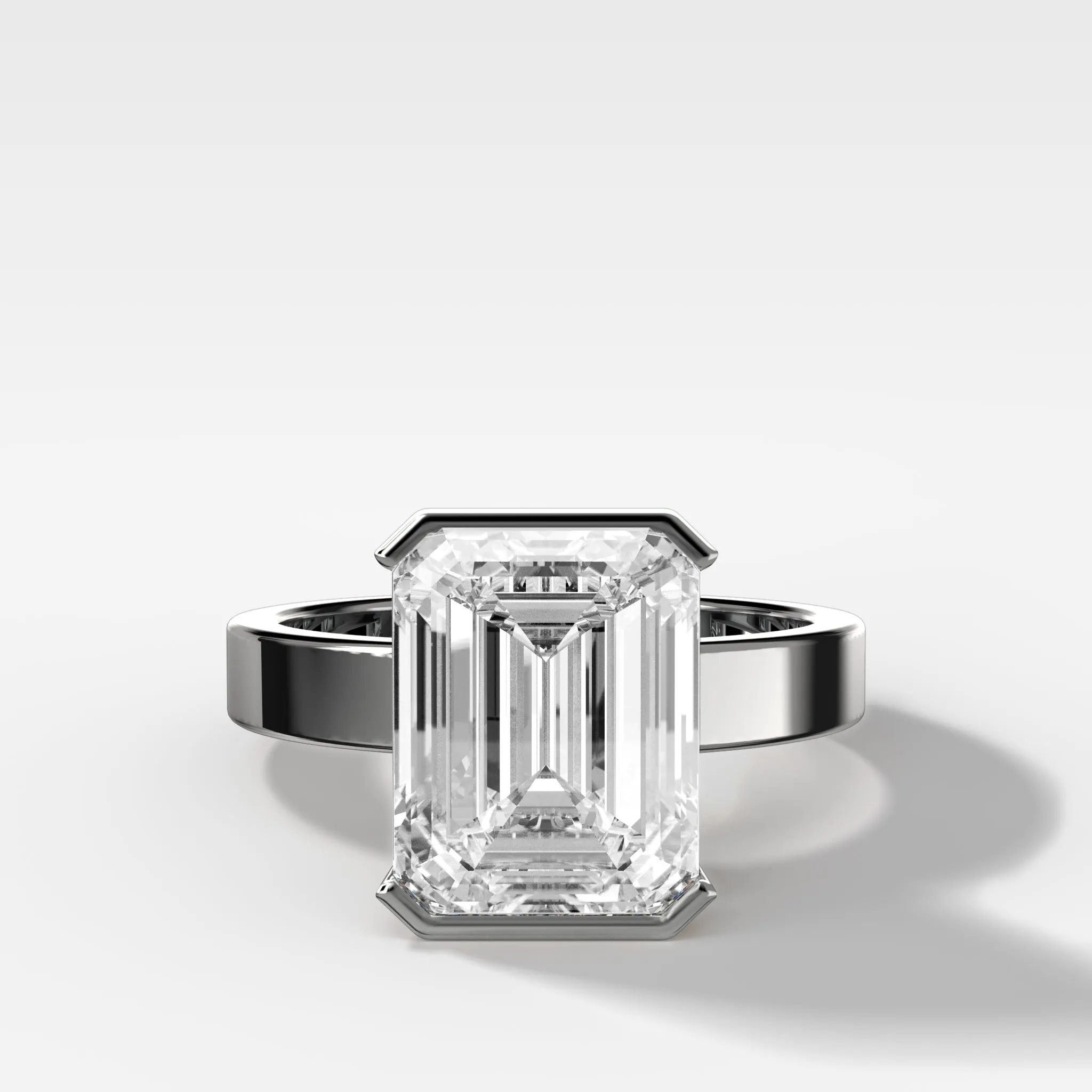 Finest Half Bezel Solitaire Engagement Ring With Emerald Cut Diamond