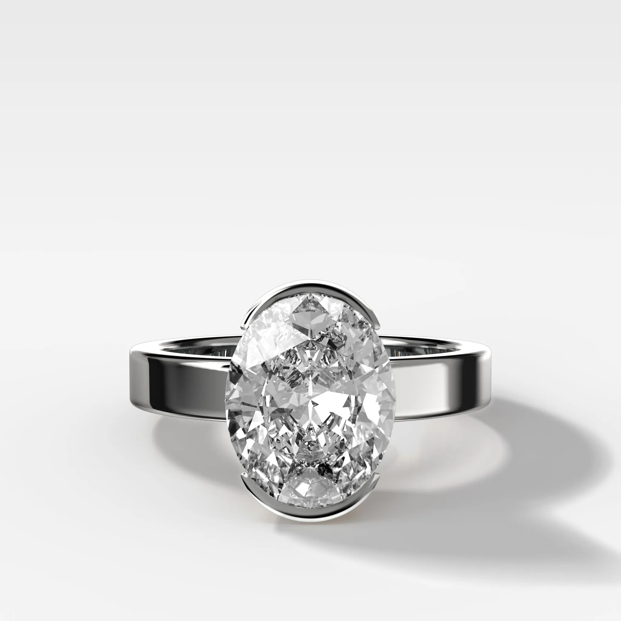 Finest Half Bezel Solitaire Engagement Ring With Oval Cut Diamond