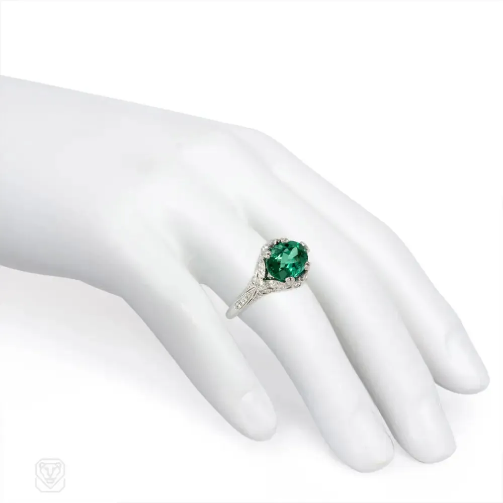 Green zircon solitaire ring with Edwardian style platinum band