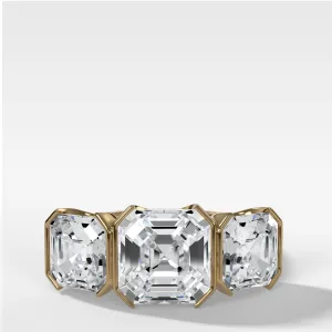 Half Bezel Triad Engagement Ring With Asscher Cut Diamonds