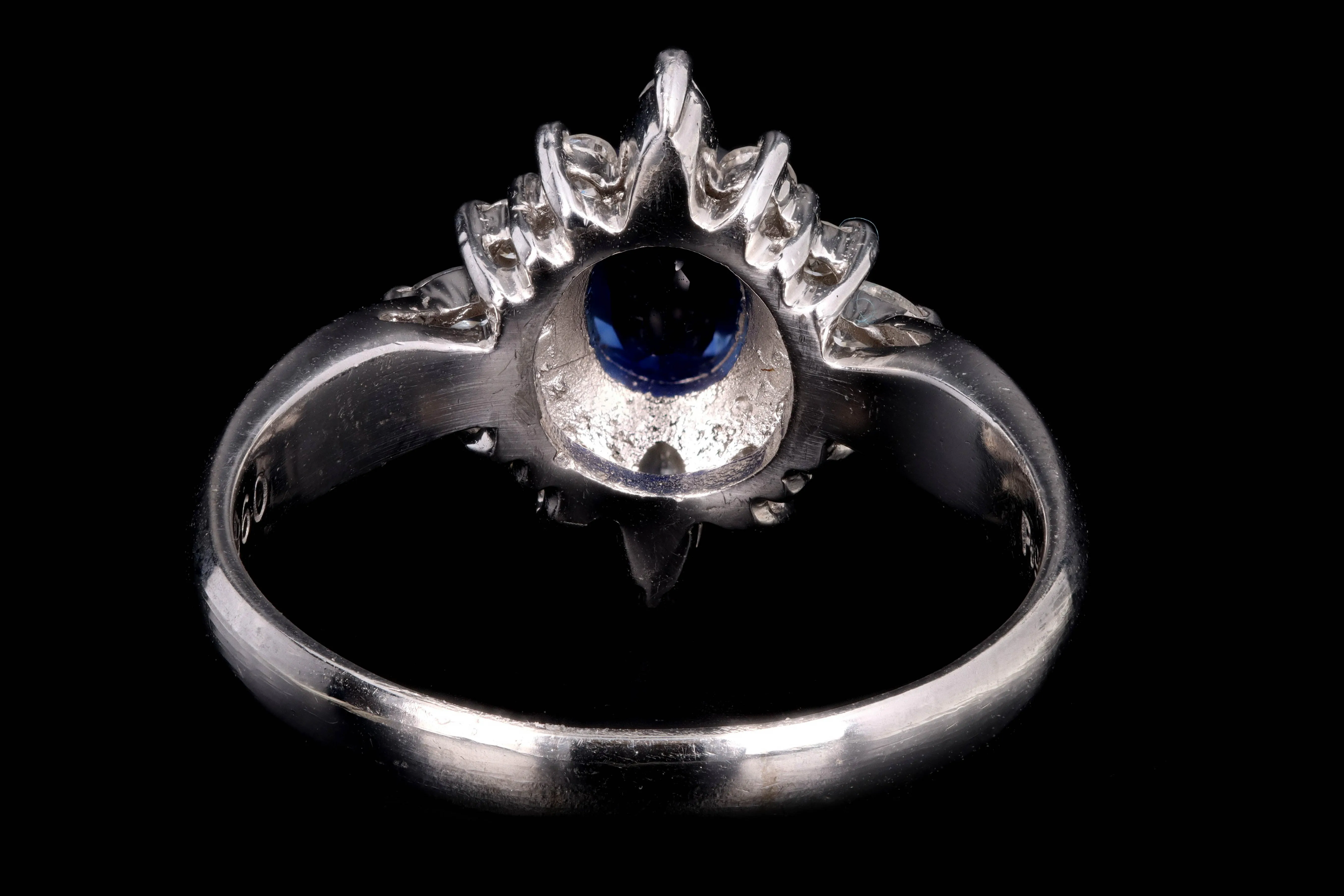 Modern Platinum .98 Carat Oval Cut Sapphire & Diamond Ring