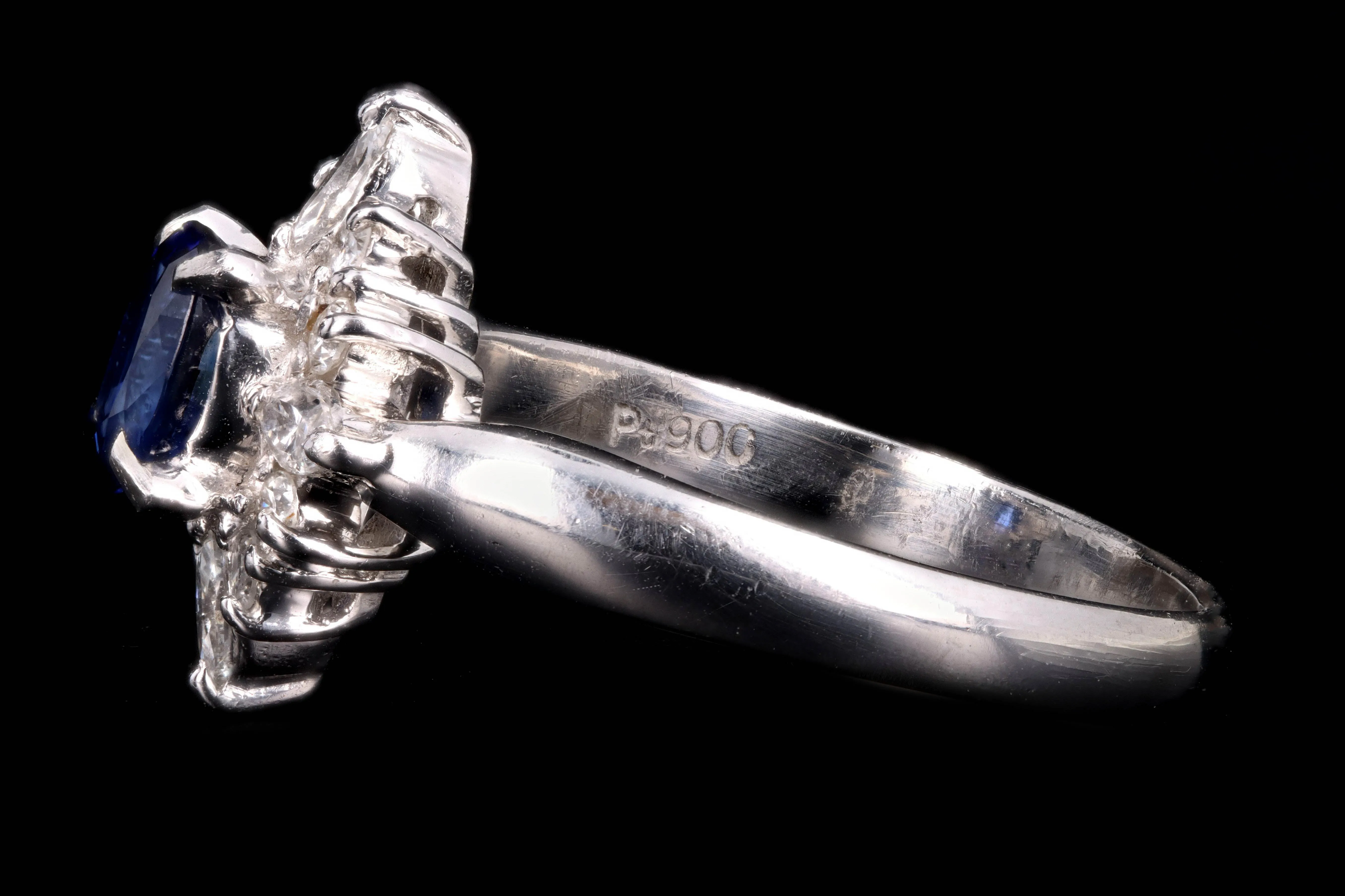 Modern Platinum .98 Carat Oval Cut Sapphire & Diamond Ring