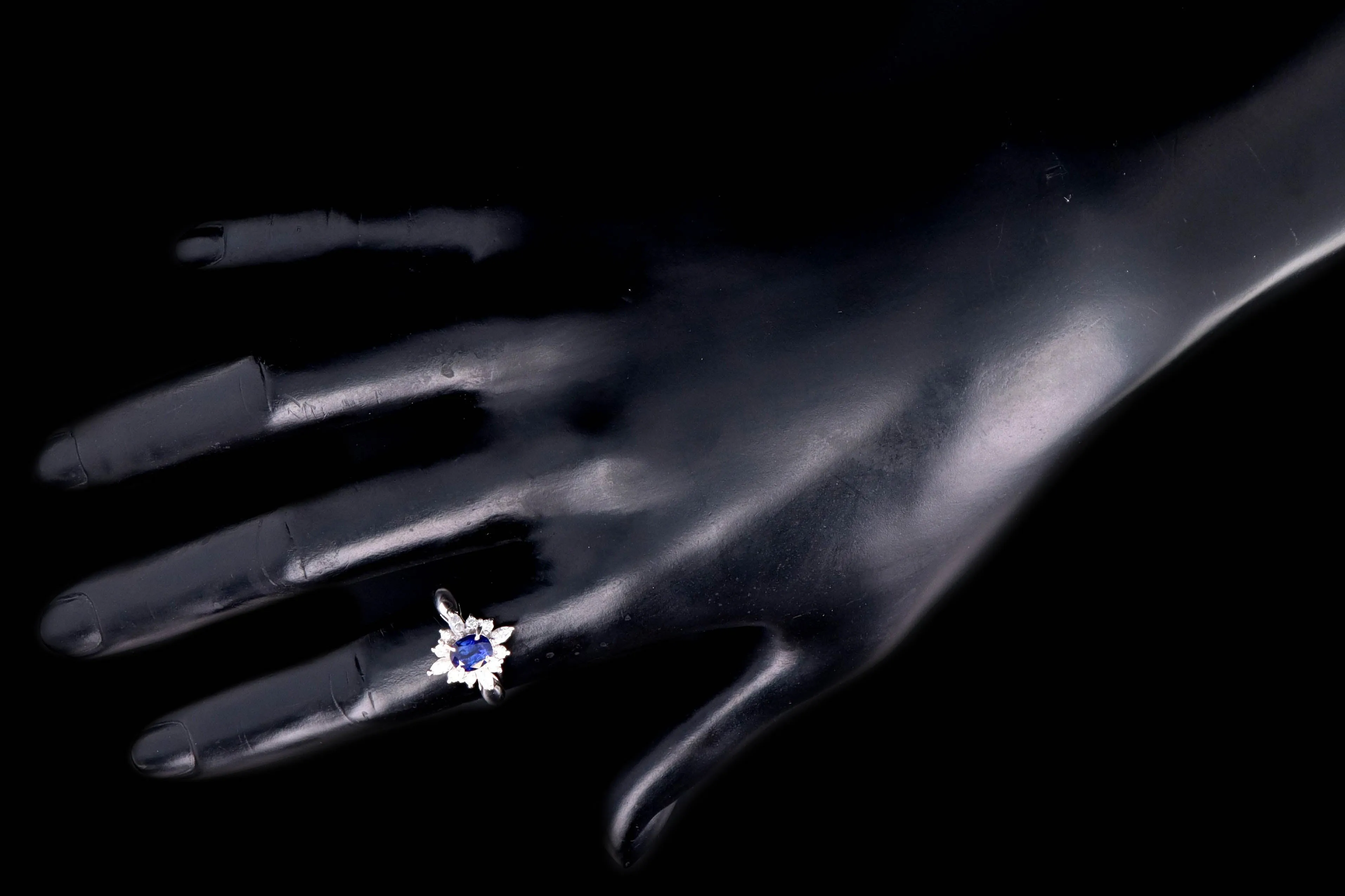 Modern Platinum .98 Carat Oval Cut Sapphire & Diamond Ring