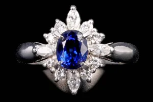 Modern Platinum .98 Carat Oval Cut Sapphire & Diamond Ring