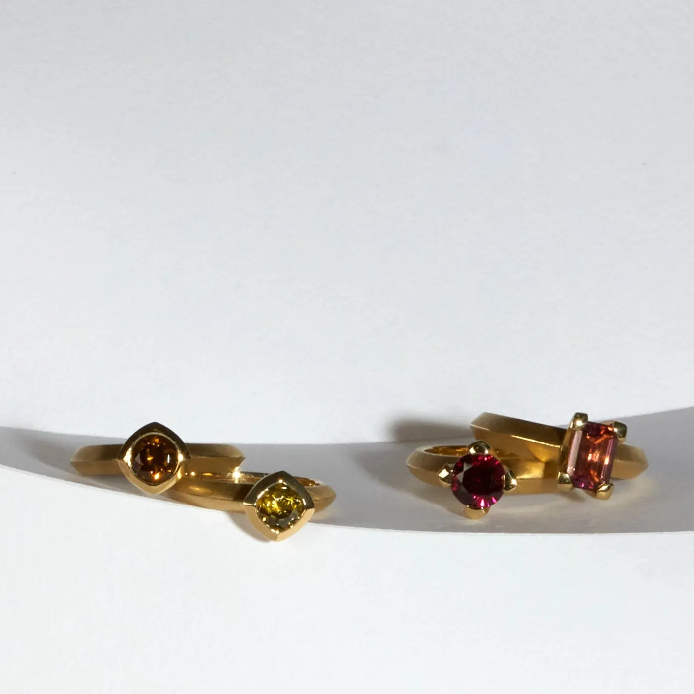 yellow mali garnet bezel set round solitaire